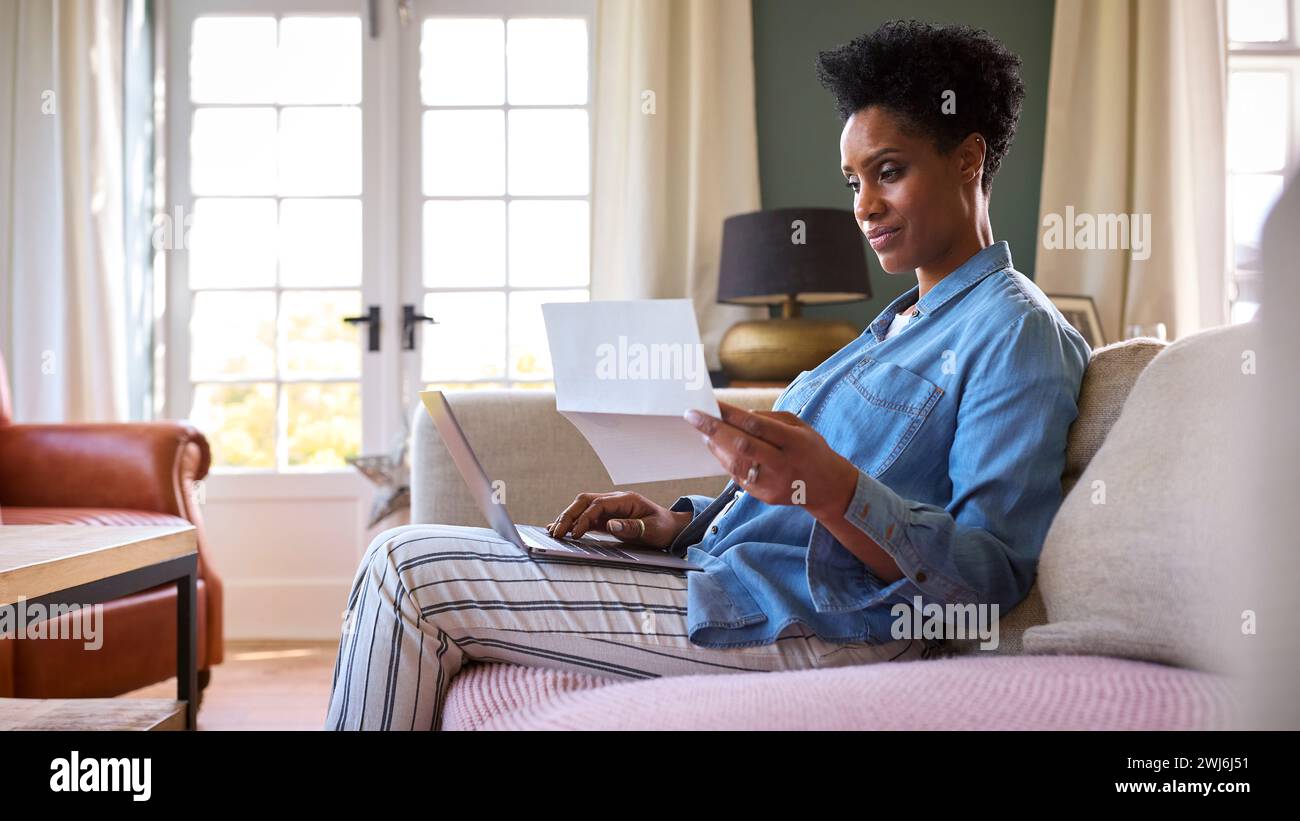 Mature black woman worried home hi-res stock photography and images - Alamy