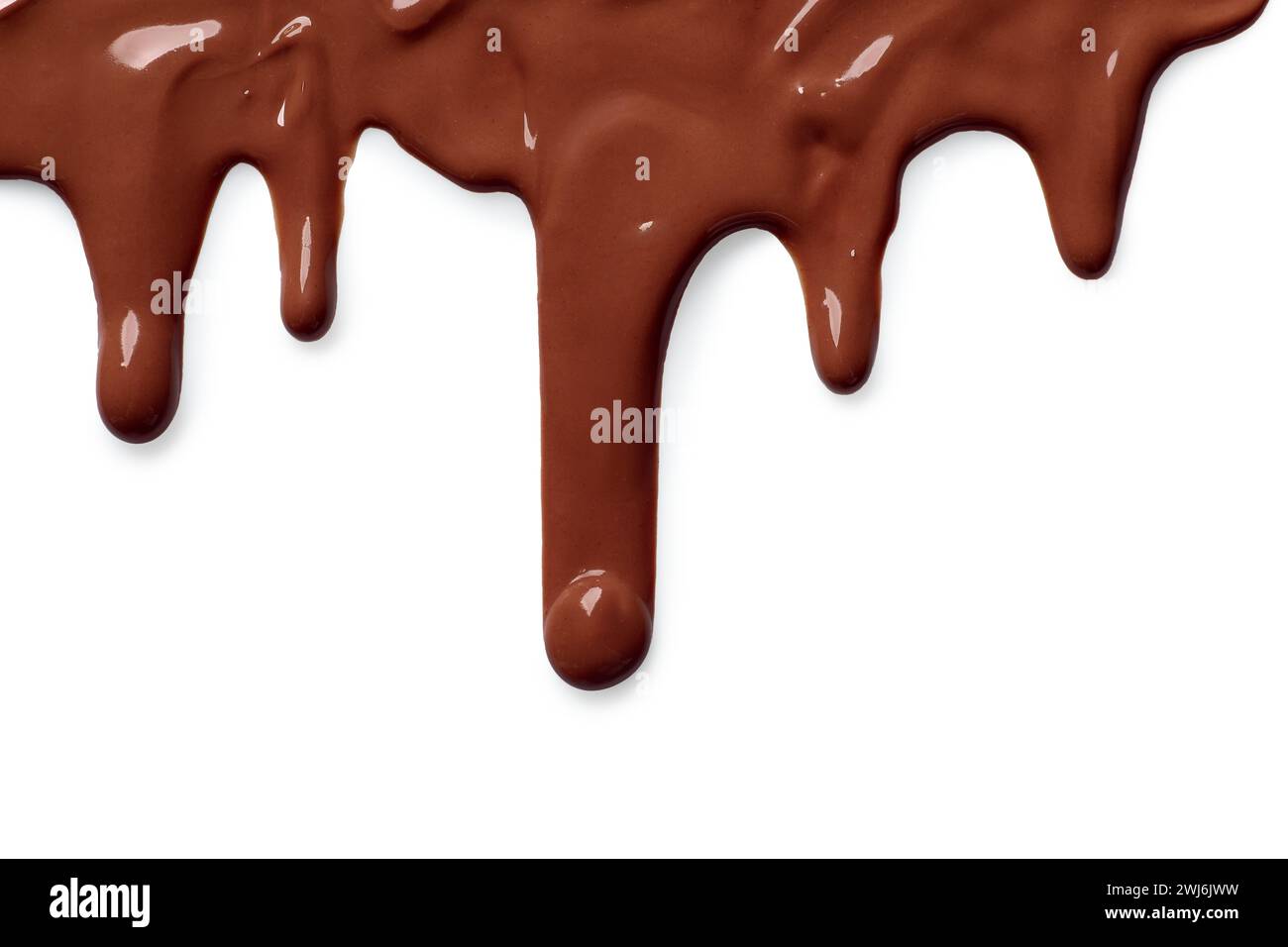 Tasty melted milk chocolate pouring down on white background Stock Photo