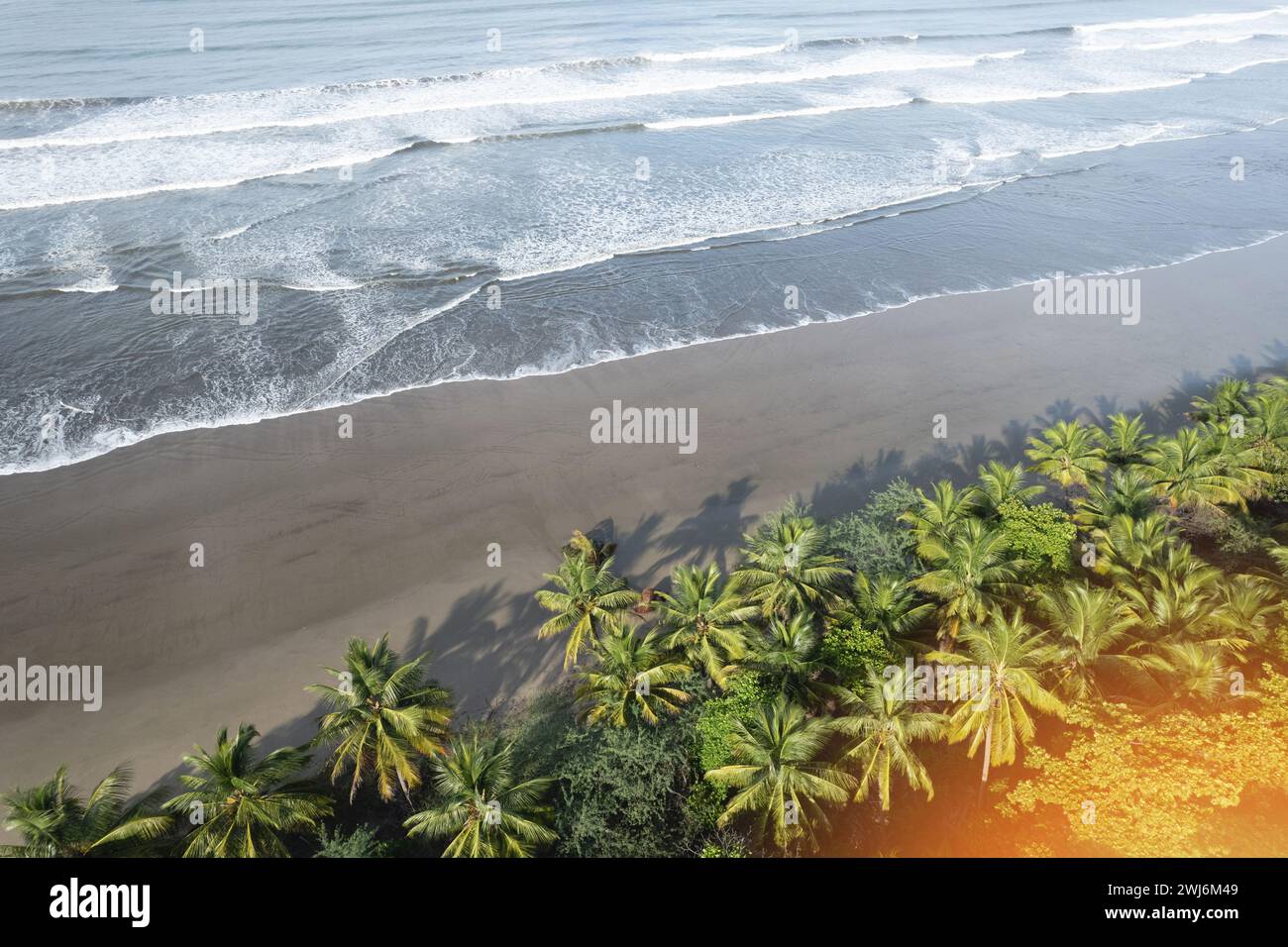 Tropical beach shore beach with shallow beach waves aerial drone view Stock Photo