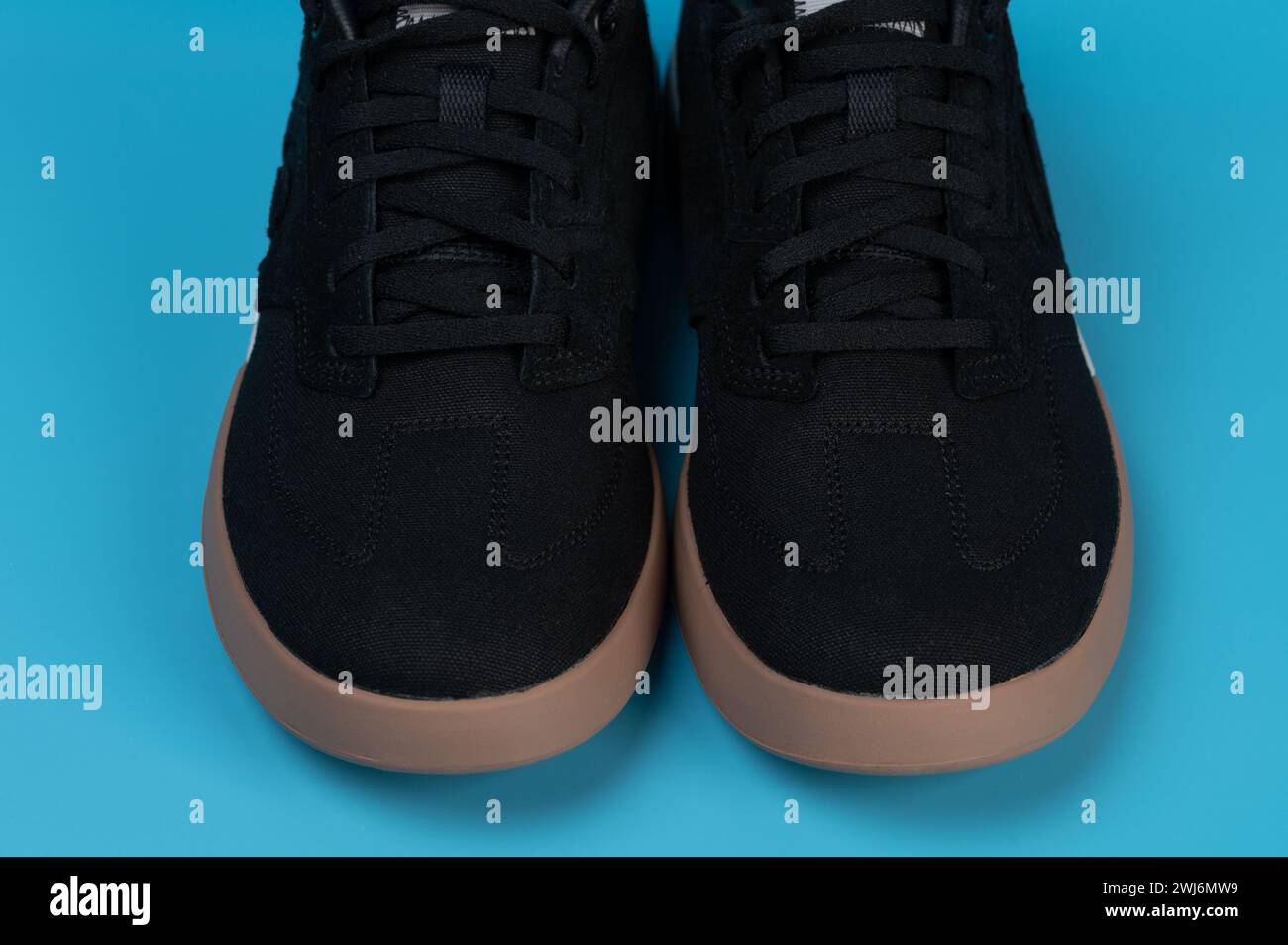 Black sneakers shoes close up view isolated Stock Photo