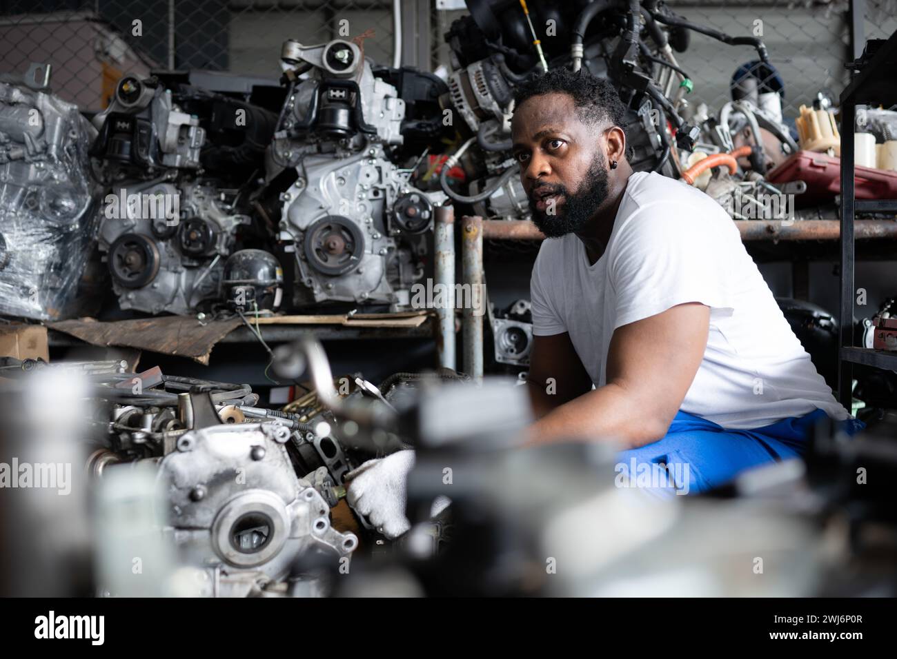 Men repairing car engine in auto repair shop, Selective focus Stock ...