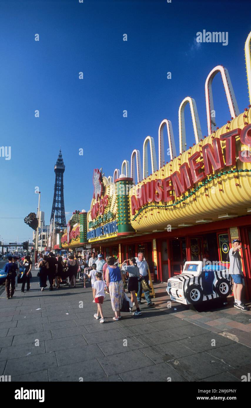 UK, Lancashire, Blackpool, the 'golden mile', the seaside frontage at Blackpool, the amusement arcades and the Blackpool tower. Stock Photo