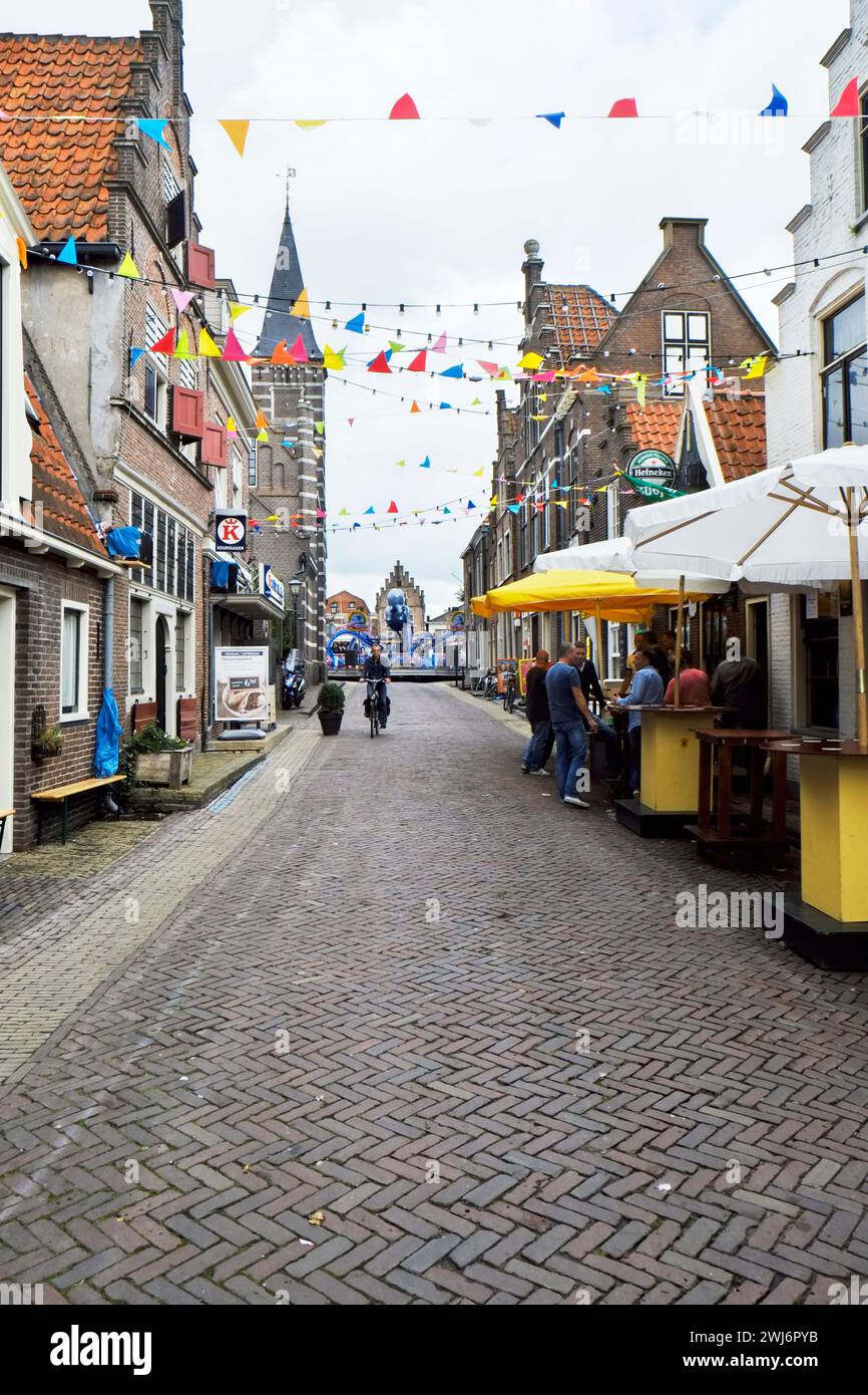 Food booths and festivities dominate Hoogstraat in old town Edam during the annual Kermis celebration. Stock Photo