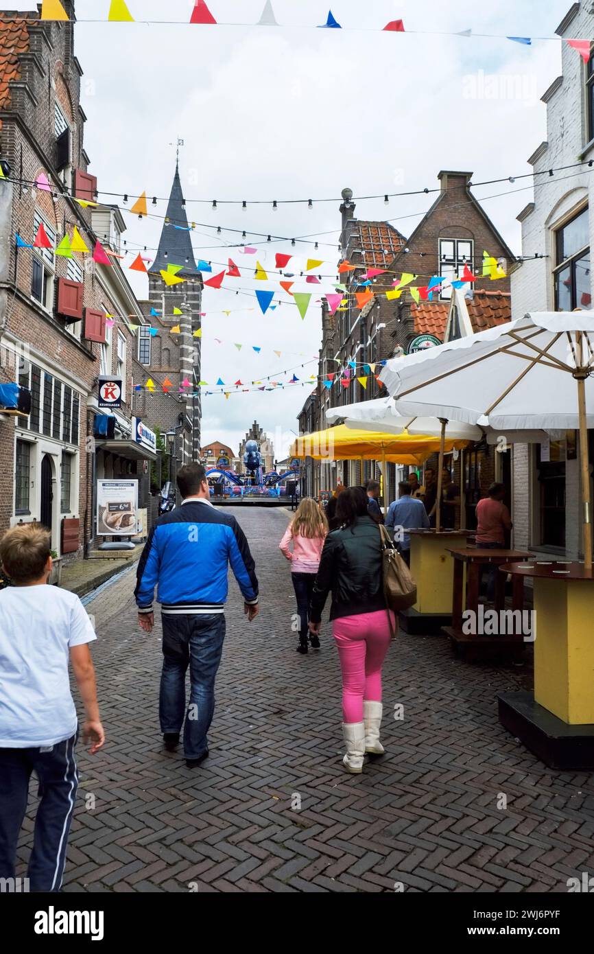 Food booths and festivities dominate Hoogstraat in old town Edam during the annual Kermis celebration. Stock Photo