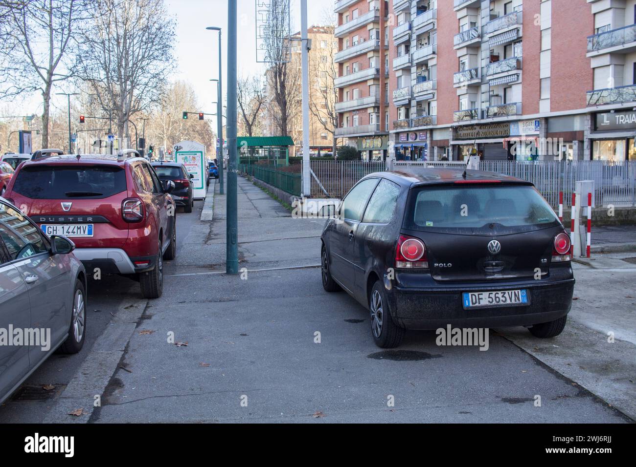 Car parked on the sidewalk in Italy (Turin) Stock Photo