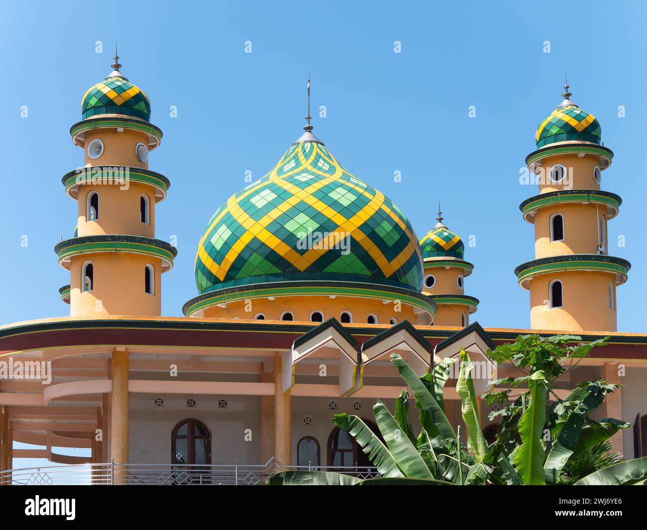 Minarets and dome Jami Masjid Al-Akmal mosque in Medewi, Bali, Indonesia. While Bali is mostly Hindu, more than 9 percent of the population is Muslim, Stock Photo