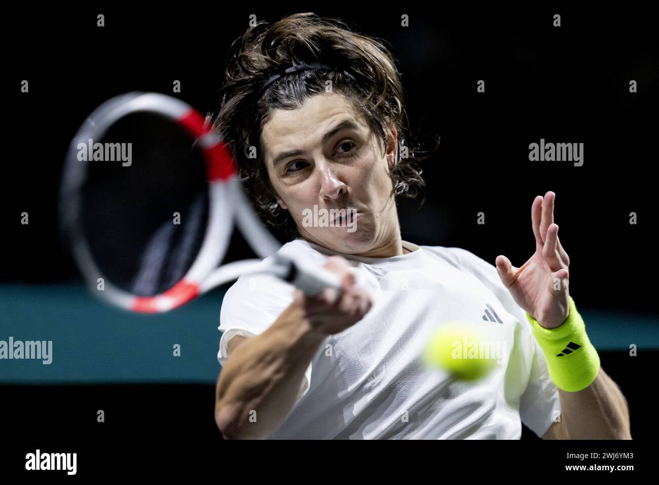 ROTTERDAM - Alexander Shevchenko (KAZ) in action against Zhizhen Zhang (CHN) during the second day of the ABN AMRO Open tennis tournament in Ahoy. ANP SANDER KONING Stock Photo
