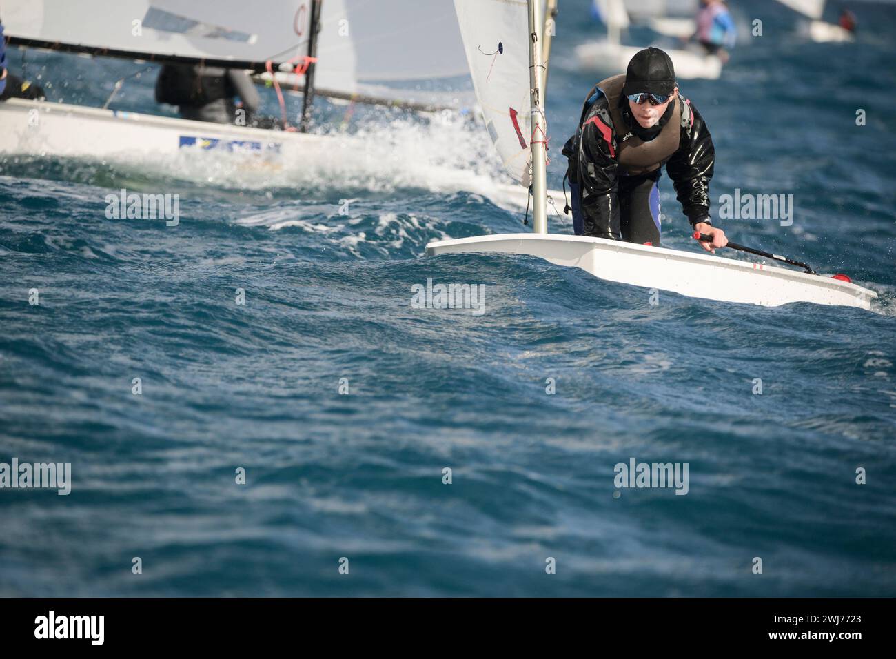 Crotone, Italy. 11th Feb, 2024. A sailor of an Italian team seen during the race. Second day of the international Optimist sailing competition “9th BPER Banca International Carnival Race Crotone”, organised by Club Velico in Crotone. Nearly 320 young sailors, from 8 different countries attended the race for the Optisud trophy. (Photo by Valeria Ferraro/SOPA Images/Sipa USA) Credit: Sipa USA/Alamy Live News Stock Photo