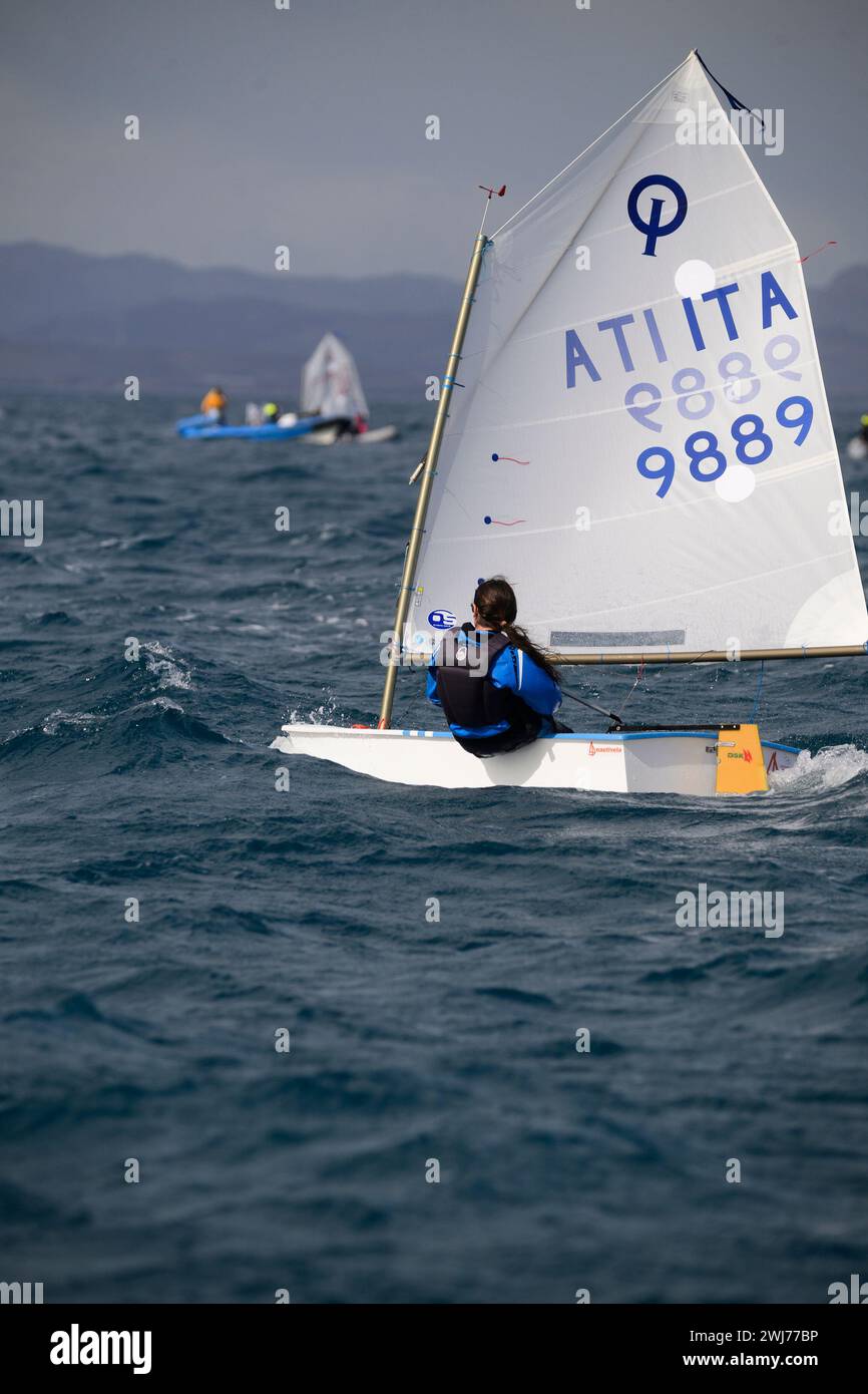 Crotone, Italy. 11th Feb, 2024. A boat of an Italian team seen during the race. Second day of the international Optimist sailing competition “9th BPER Banca International Carnival Race Crotone”, organised by Club Velico in Crotone. Nearly 320 young sailors, from 8 different countries attended the race for the Optisud trophy. (Photo by Valeria Ferraro/SOPA Images/Sipa USA) Credit: Sipa USA/Alamy Live News Stock Photo