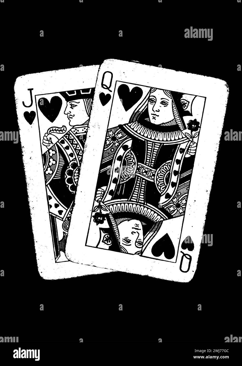 A pair of vintage playing cards in black and white isolated on a black