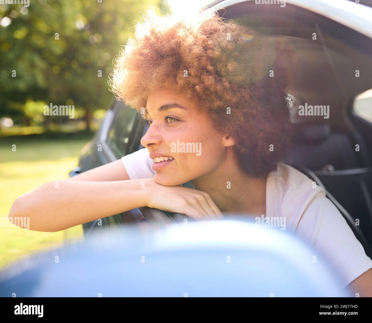 Woman Looking Out Of Passenger Car Window On Road Trip Vacation Stock ...