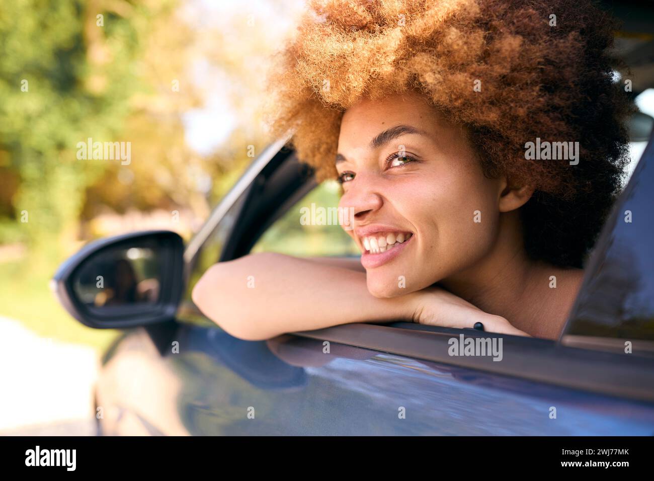 Woman Looking Out Of Passenger Car Window On Road Trip Vacation Stock ...