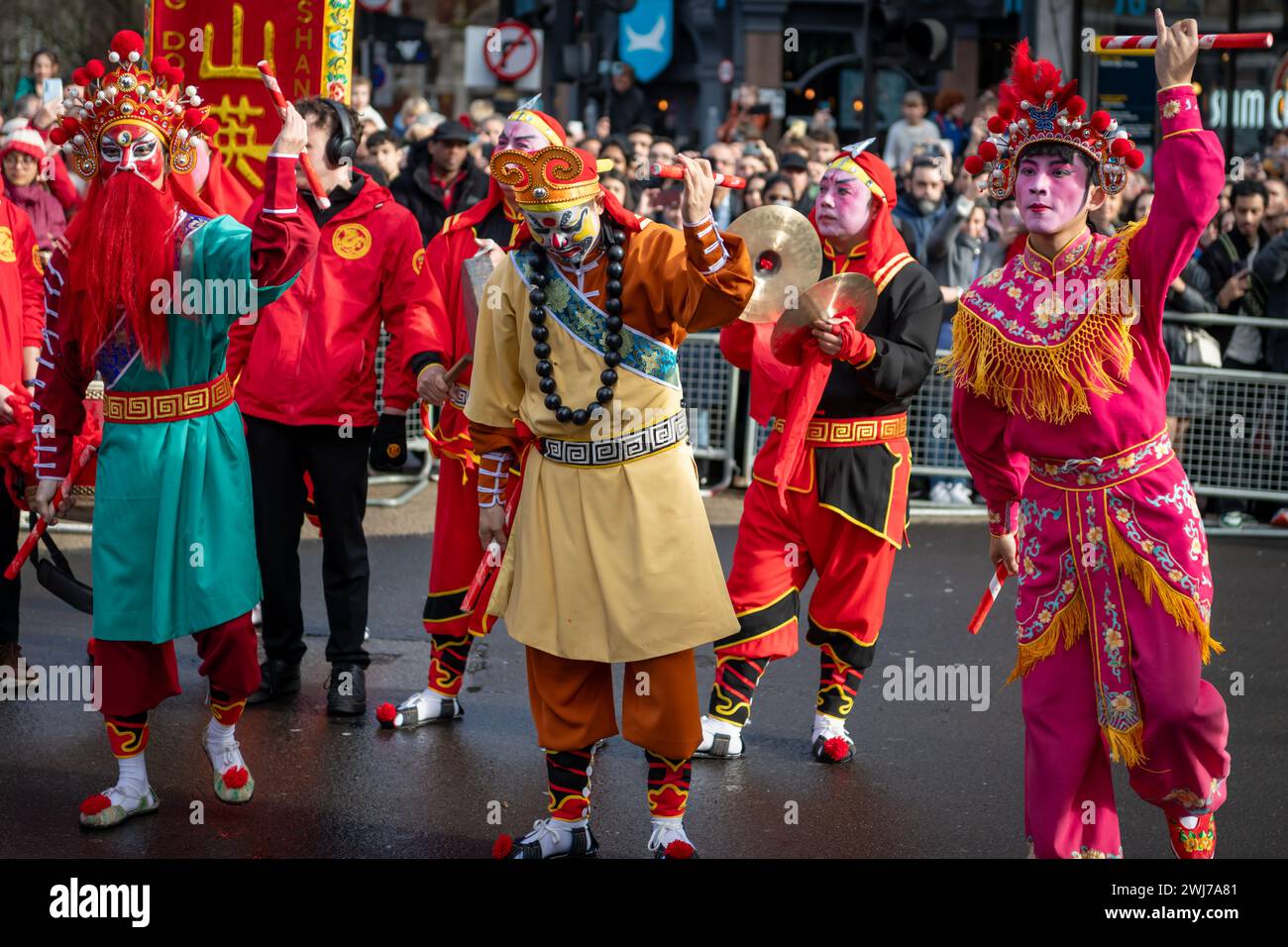 London. UK- 02.11.2024. A dance ground performing a Chinese folk dance in the Chinese New Year celebration parade in China Town. Stock Photo