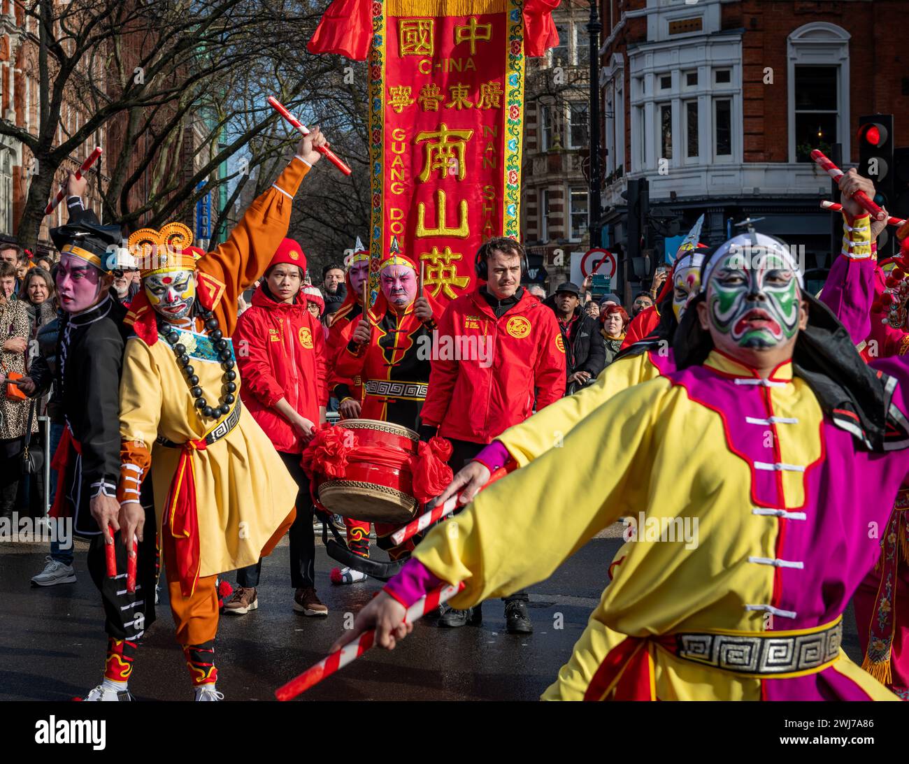 London. UK- 02.11.2024. A dance ground performing a Chinese folk dance in the Chinese New Year celebration parade in China Town. Stock Photo