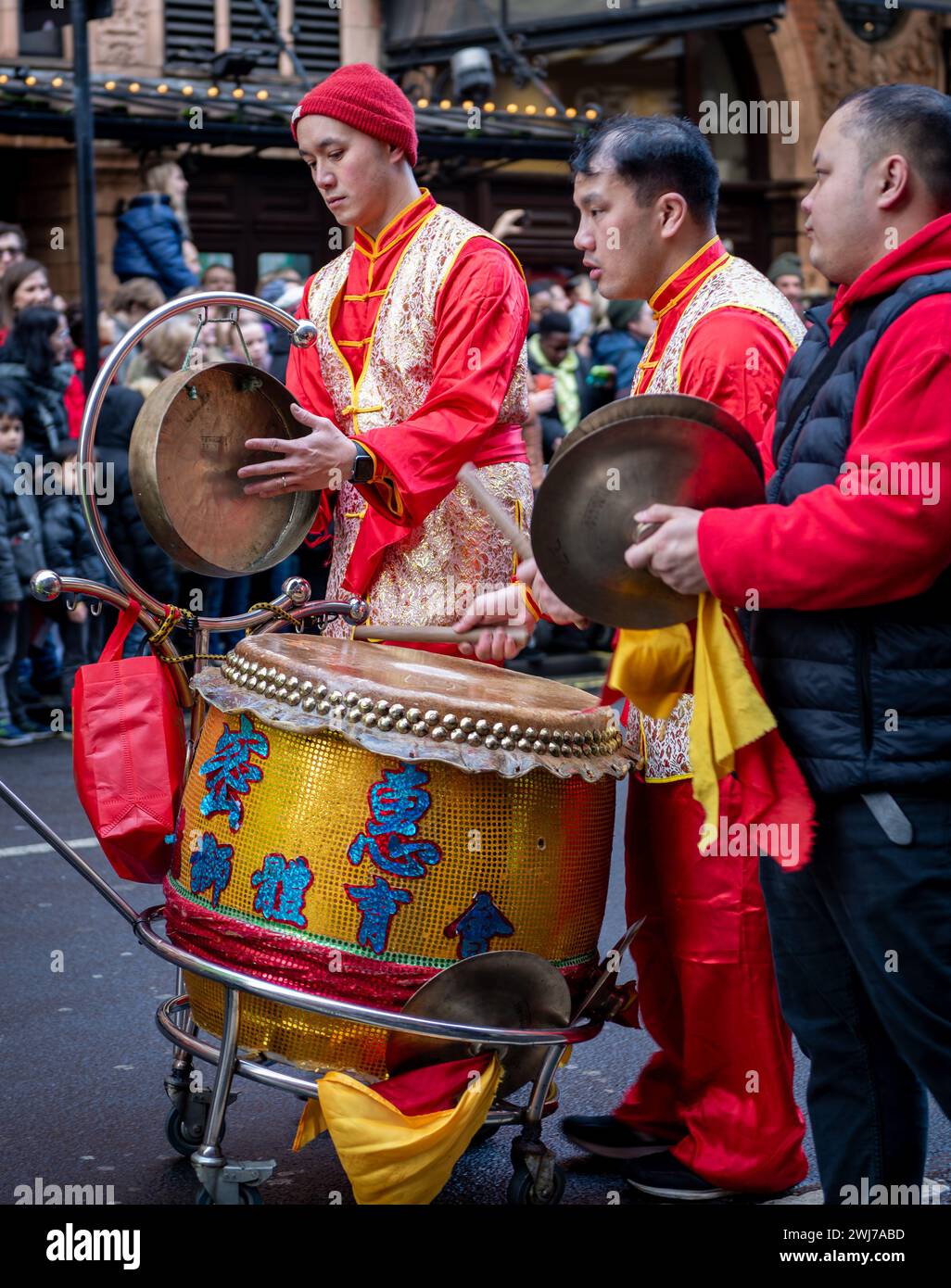 London. UK- 02.11.2024. A Lion Dance percussion group performing in the Chinese New Year celebration parade in China Town. Stock Photo