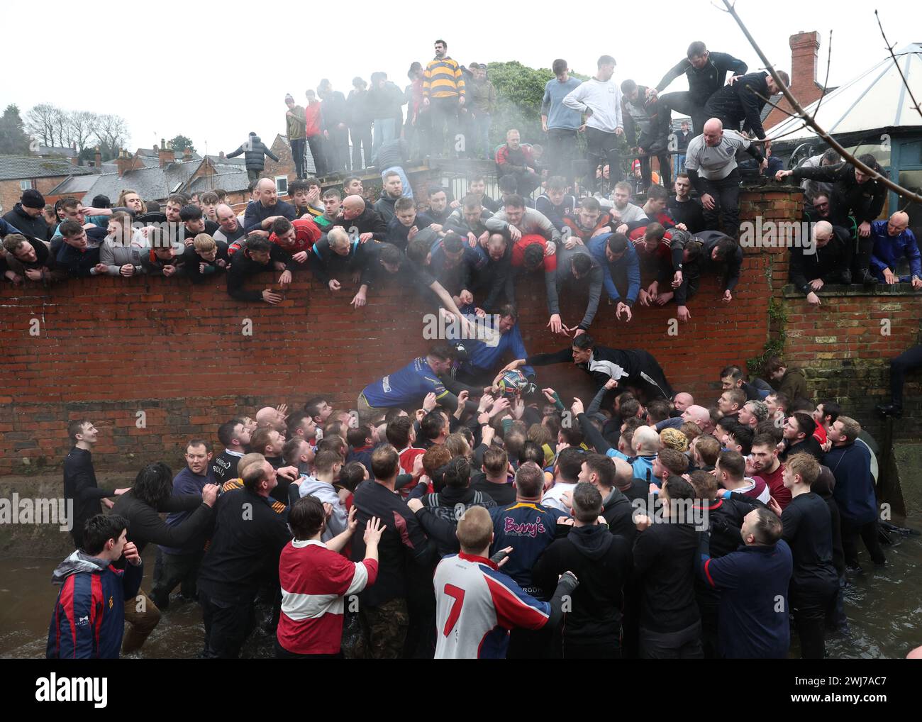 The Royal Shrovetide Football match has been played between the villagers of Ashbourne in Derbyshire since 1667. One side is known as the Upards and the other side as the Downards. Each team attempts to carry the ball back to their own goal to score. Picture credit should read: Cameron Smith/Sportimage Credit: Sportimage Ltd/Alamy Live News Stock Photo