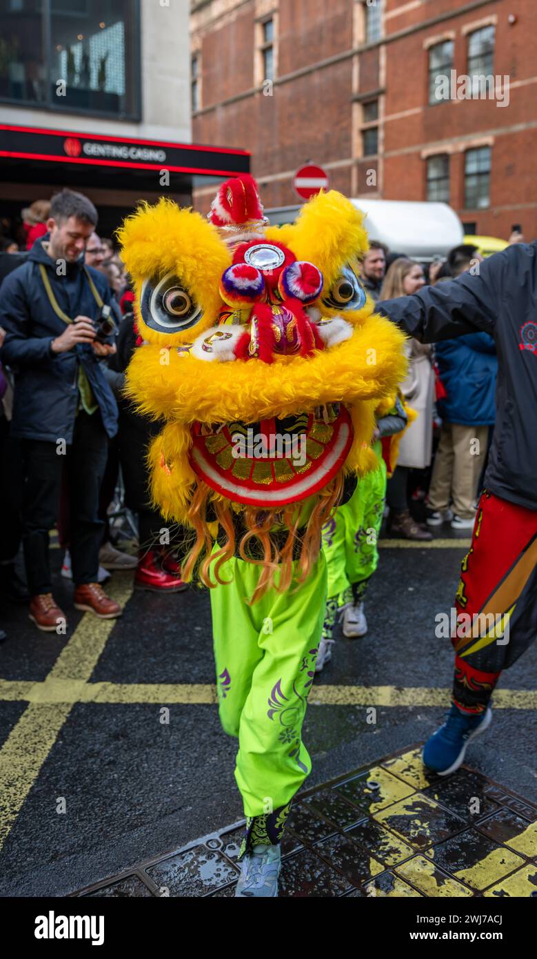 London. UK- 02.11.2024. A cheeky lion head used by a group of children to perform lion dancing in the Chinese New Year Celebration parade in China Tow Stock Photo