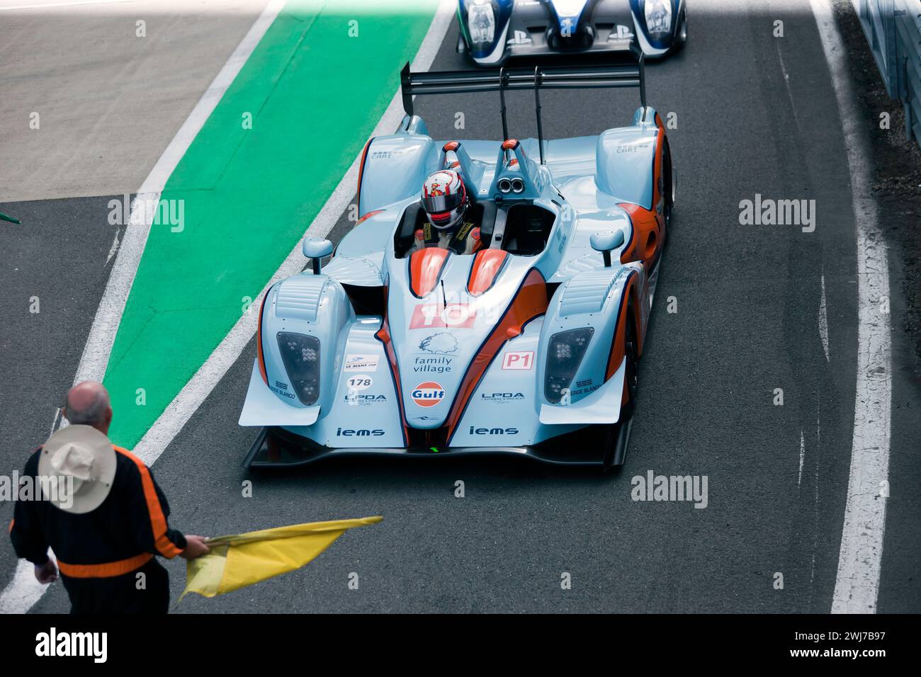 The Blue and Orange, 2011, Pescarolo LMP1, of Timothy and Harindra de Silva, lining up in the pit lane for the Start of the Masters Endurance Legends. Stock Photo