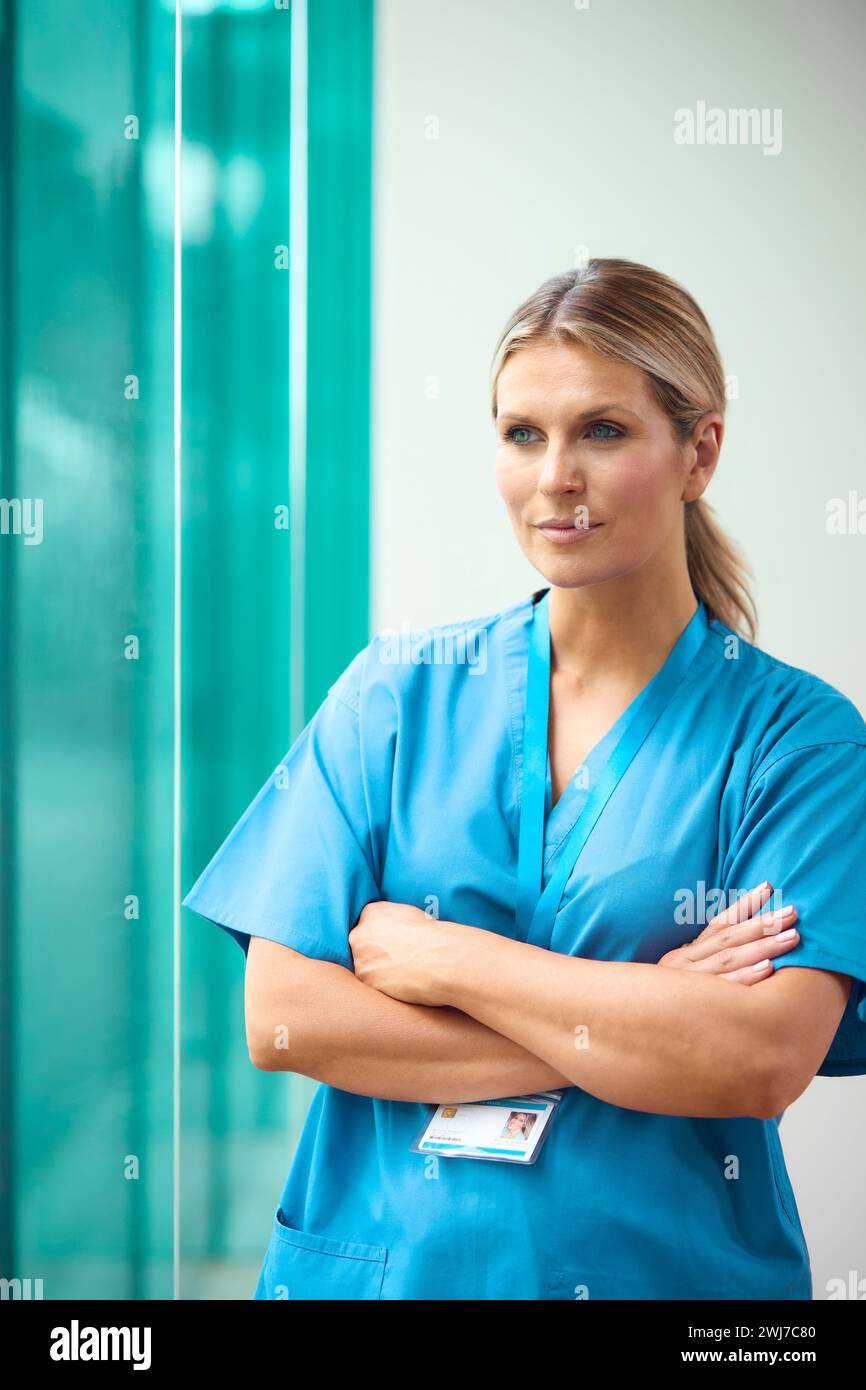 Portrait Of Mature Female Doctor Wearing Scrubs In Hospital Stock Photo Alamy