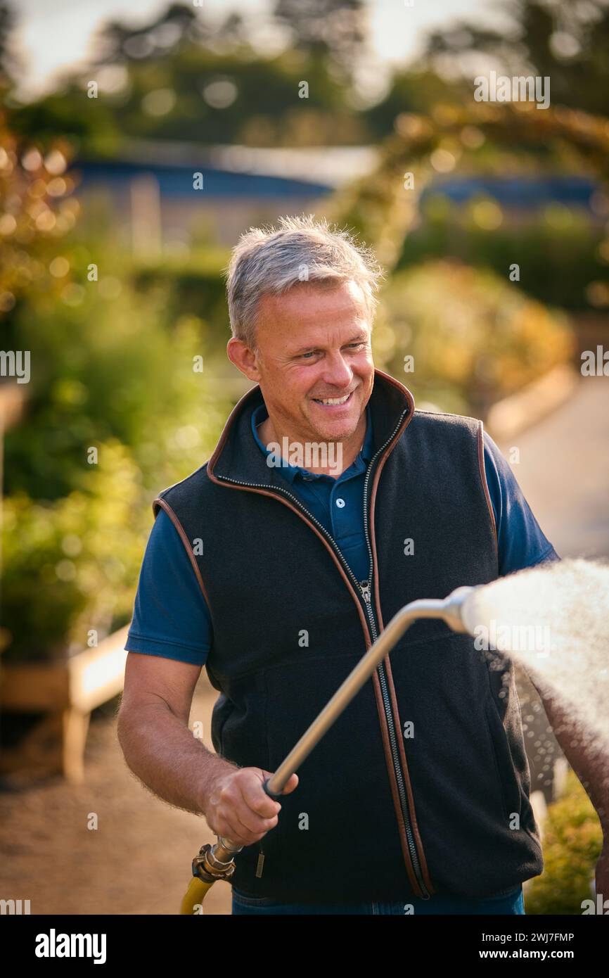 Mature man working in garden centre hi-res stock photography and images ...