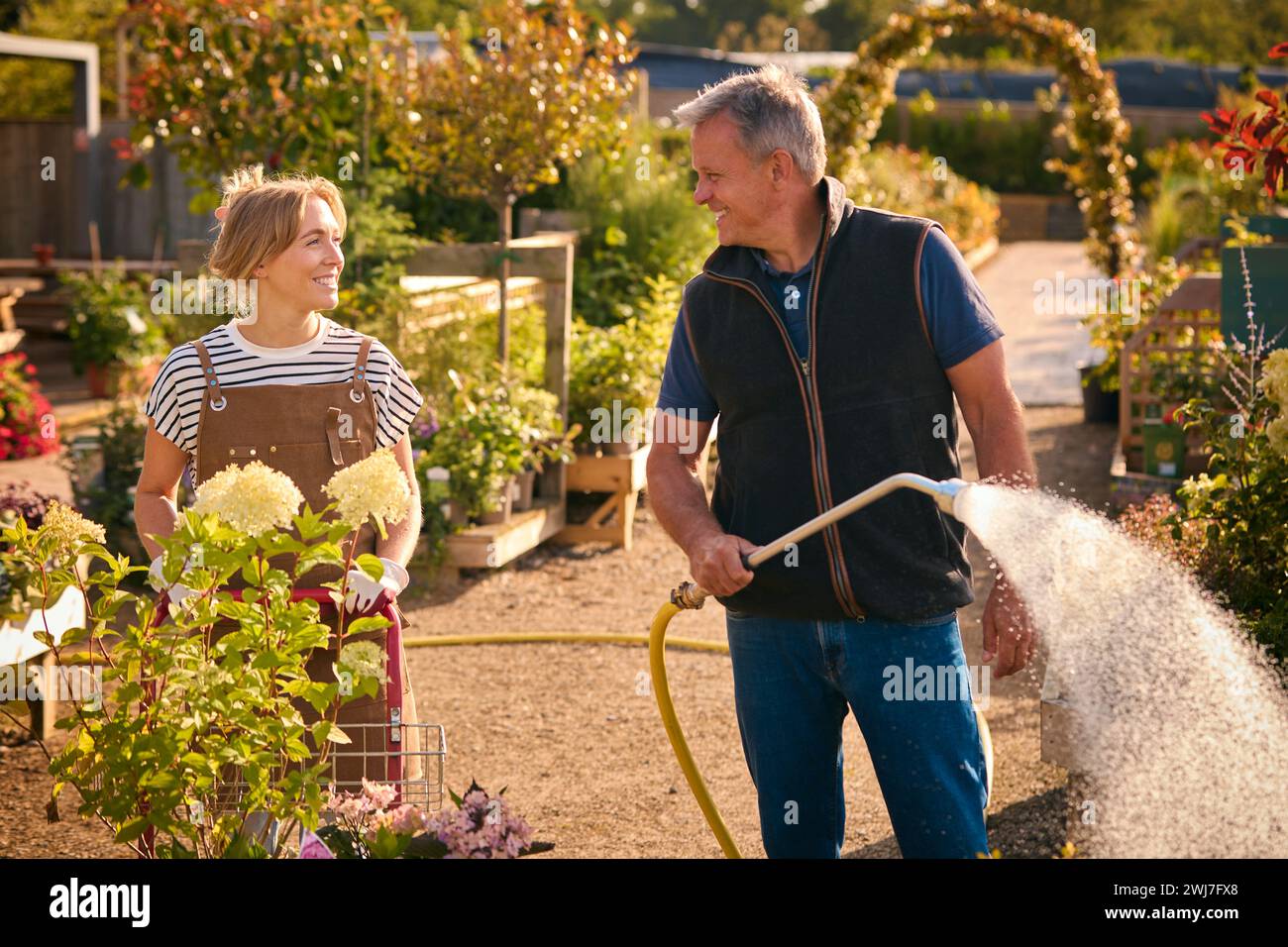 Mature man working in garden centre hi-res stock photography and images ...