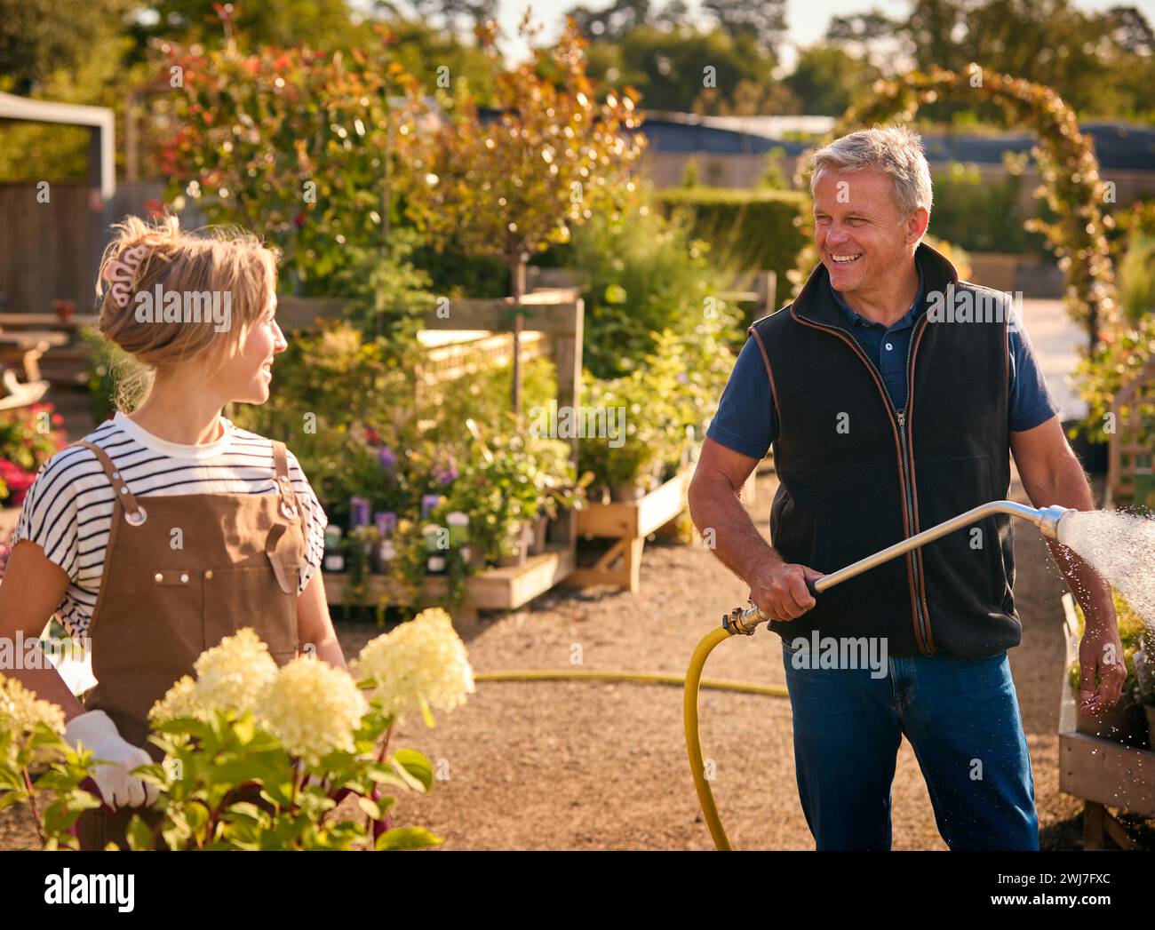 Mature man working in garden centre hi-res stock photography and images ...