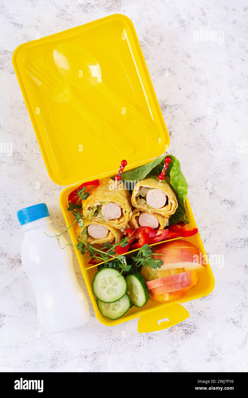 School lunch box with sausage roll in omelette with lavash. Lunchbox ...