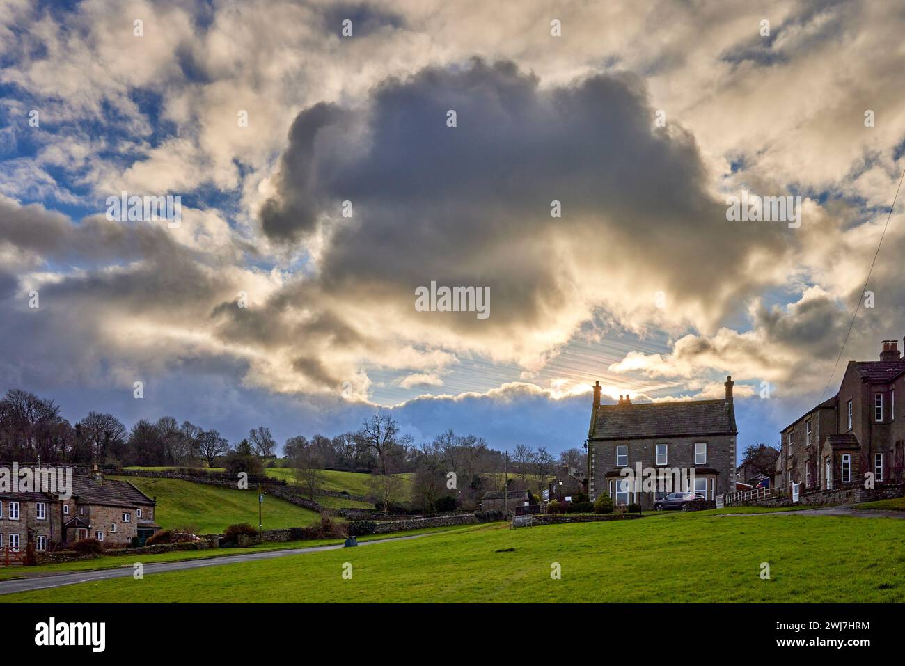 Looking west and a dramatic sky hangs over private houses in West