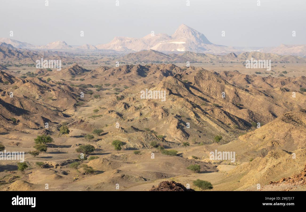 A view from the summit of a black smoker looking at hills made from pillow basalts in Oman Stock Photo