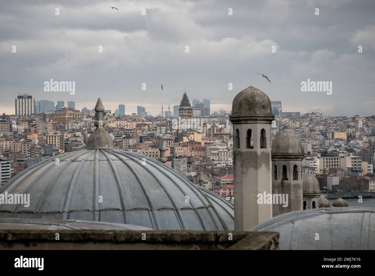 Between Epochs: An Embrace of Istanbul's Galata Tower and Süleymaniye Mosque Stock Photo