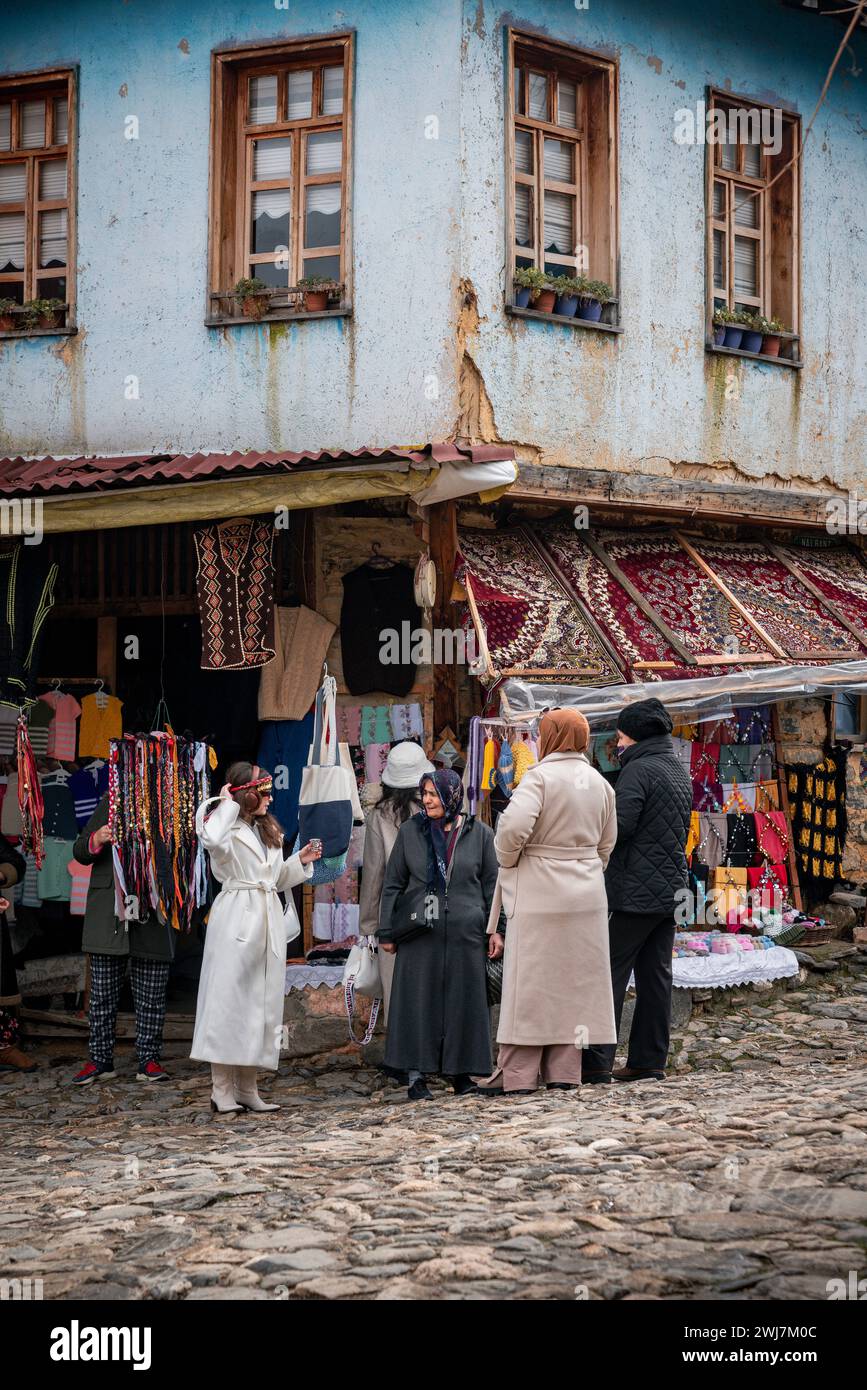 Vibrant Encounters: A Colorful Dialogue in Cumalıkızık's Streets Stock Photo