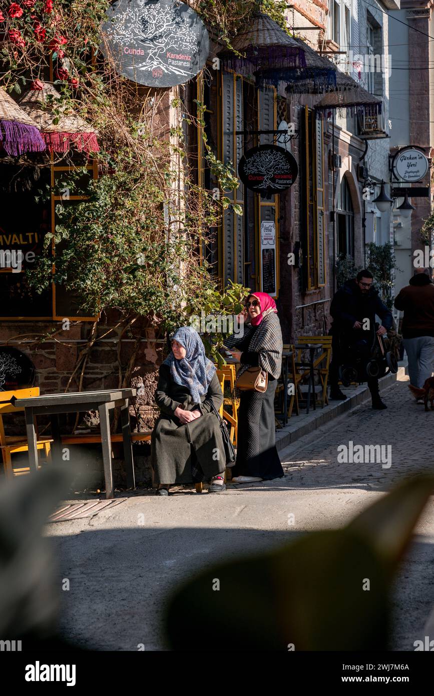 Café Chronicles: A Mother-Daughter Tale in the Heart of Ayvalık Stock Photo