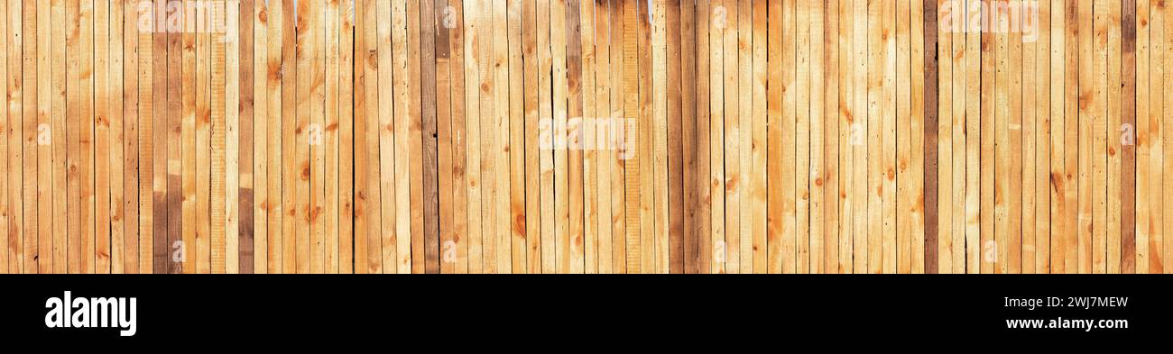 Wide wooden wall with vertical boards texture. Stock Photo