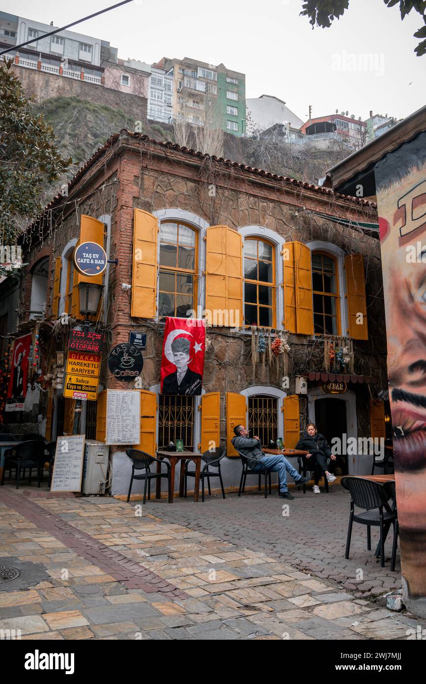 Conversations in Color: A Lively Encounter at Izmir's Yellow Café Stock Photo