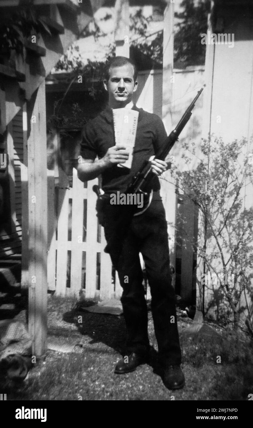 Lee Harvey Oswald. Portrait of the assassin of John F Kennedy, Lee Harvey Oswald (1939-1963), taken in Oswald's back yard, Neely Street, Dallas, Texas, March 1963. Stock Photo