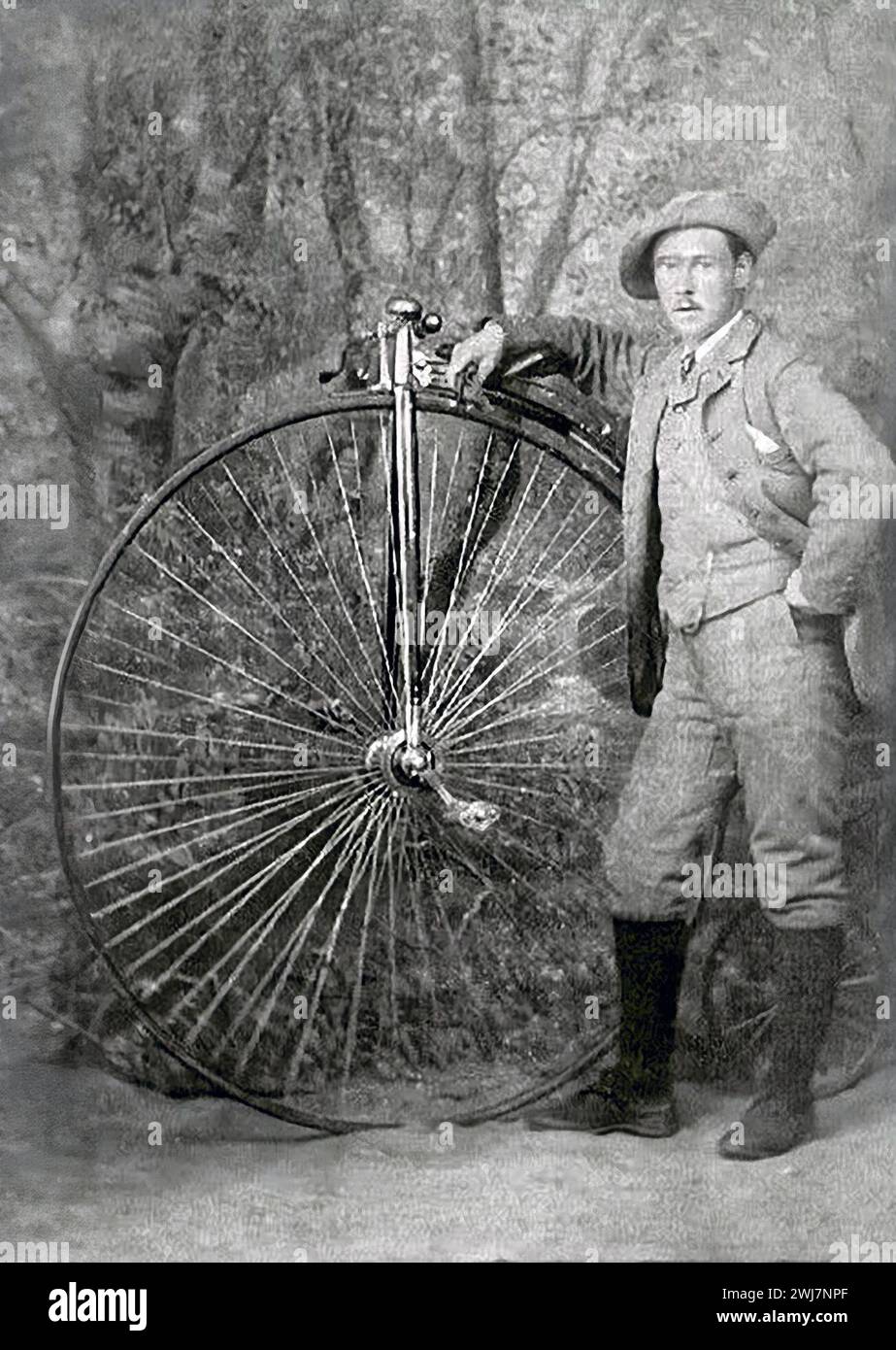 Penny Farthing. Man standing next to a penny farthing in Fife, Scotland, 1880 Stock Photo