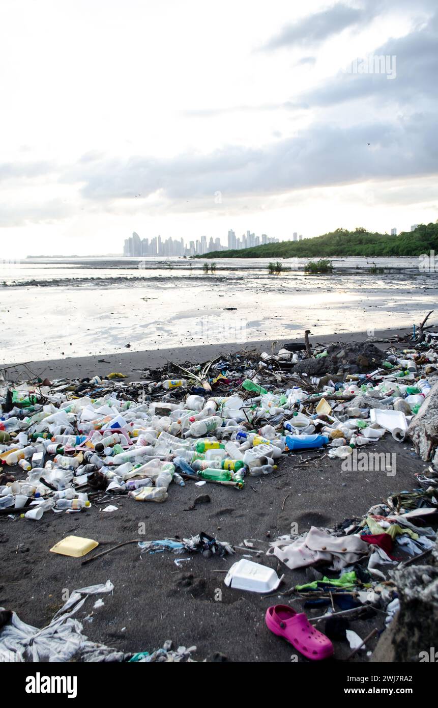 Plastic pollution at Rio Abajo River mouth in Costa del Este poses serious threats to marine life and coastal ecosystems. Stock Photo