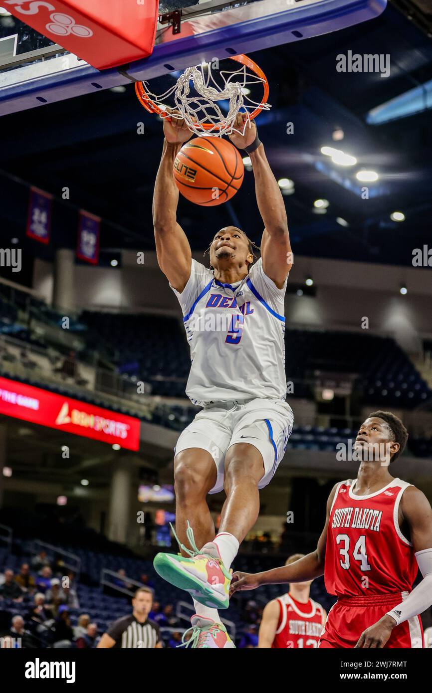 Churchill Abass #5 Center from the DePaul Blue Demons performing a dunk in Chicago, IL at Wintrust Arena. Stock Photo