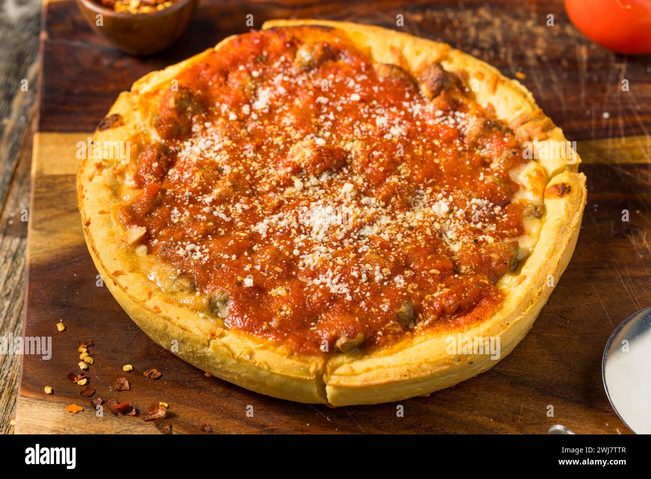 Homemade Mini Chicago Style Deep Dish Pizza with Sausage Stock Photo