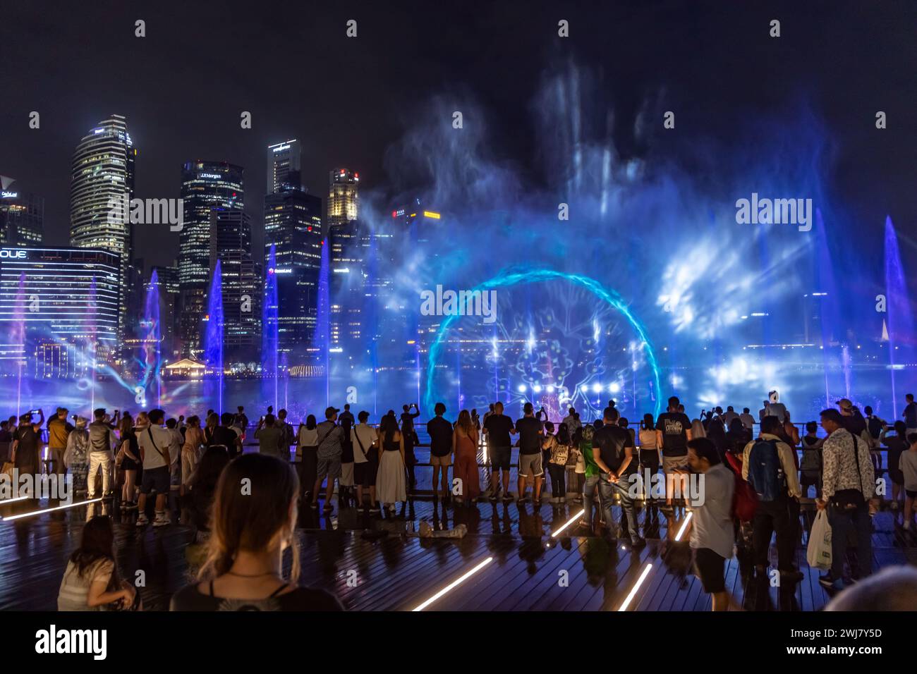 Free-to-public outdoor Light and Water Show along promenade in front of Marina Bay Sands, Singapore Stock Photo