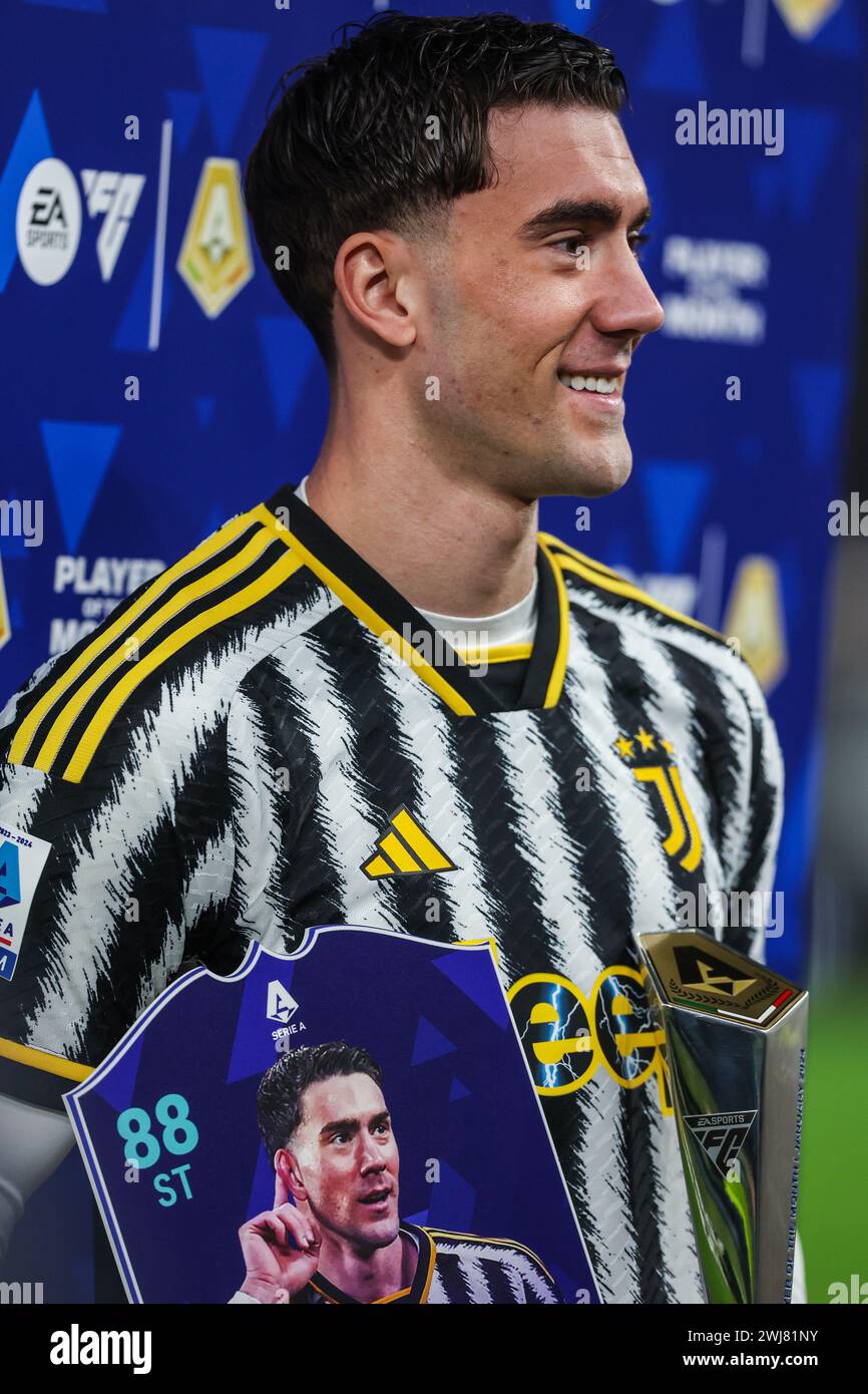 Turin, Italy. 12th Feb, 2024. Dusan Vlahovic of Juventus FC poses for a photo with his MVP trophy during Serie A 2023/24 football match between Juventus FC and Udinese Calcio at Allianz Stadium. Final score; Juventus 0 : 1 Udinese Calcio. (Photo by Fabrizio Carabelli/SOPA Images/Sipa USA) Credit: Sipa USA/Alamy Live News Stock Photo