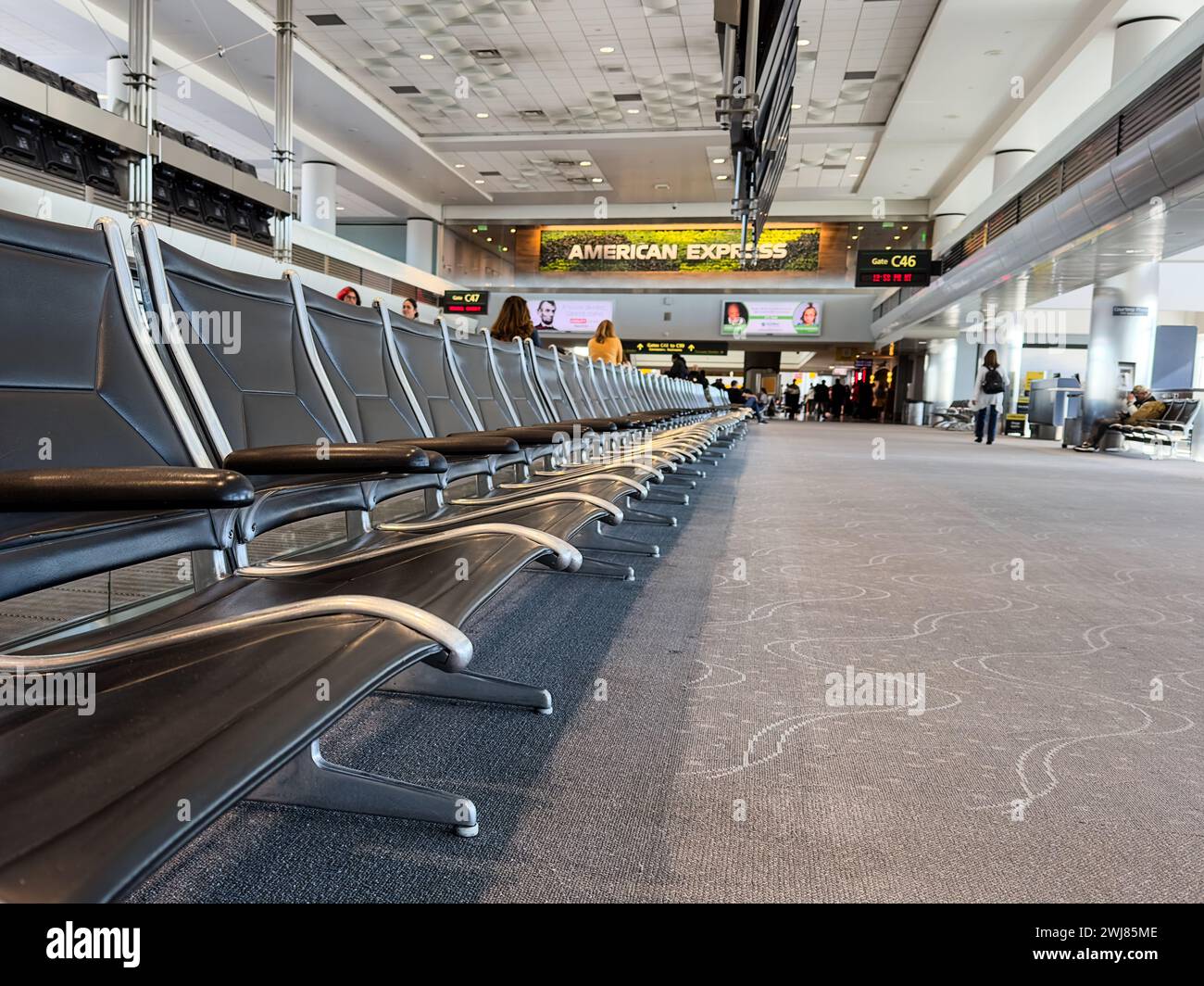 Airport seating in Denver International Airport terminal Stock Photo