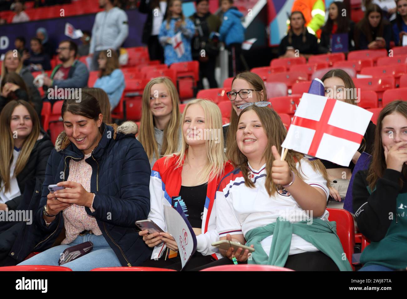 Young female fans with flags England v Austria UEFA Womens Euro 6 July 2022 Old Trafford Manchester Stock Photo