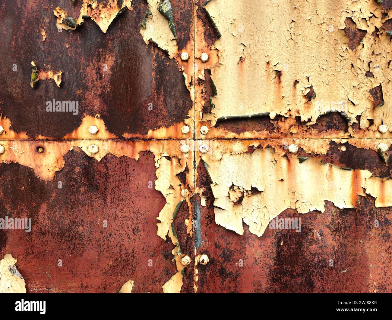 Peeling paint and rust on hangar doors Stock Photo