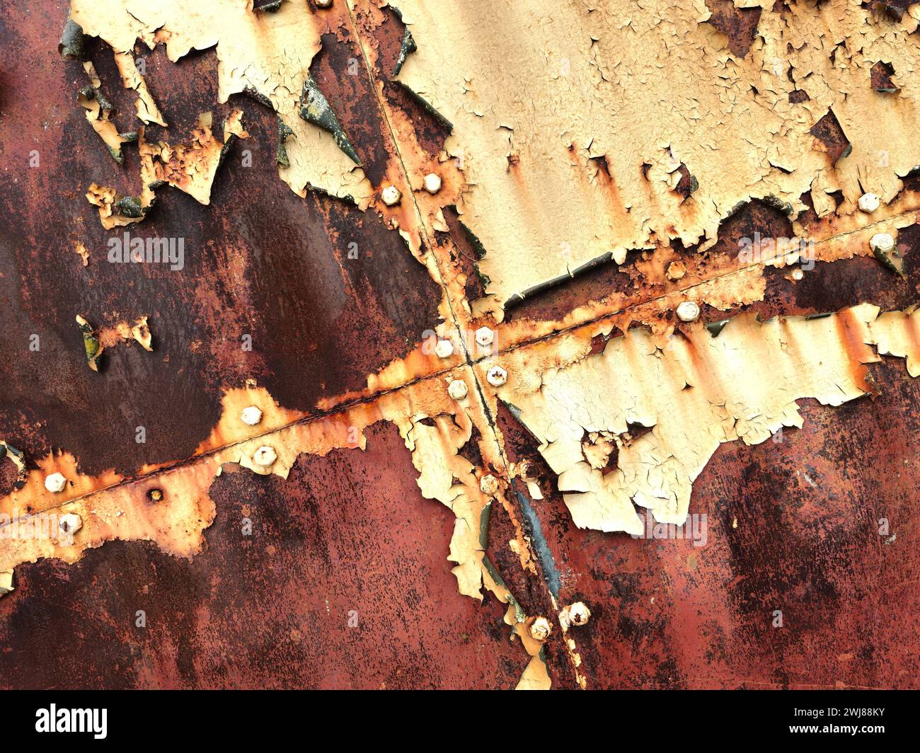 Peeling paint and rust on hangar doors Stock Photo