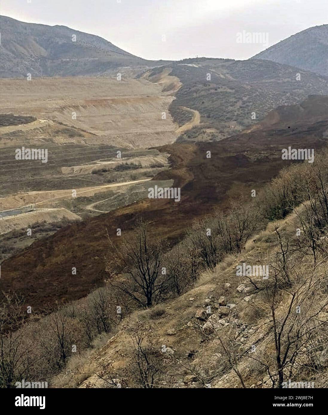 Erzincan, T?Rkiye. 13th Feb, 2024. Photo taken on Feb. 13, 2024 shows the scene of a landslide in a gold mine area in the Ilic district of Erzincan Province, T¨¹rkiye. At least nine workers were believed to be trapped in a landslide in a gold mine area on Tuesday in the Ilic district, local NTV reported, citing local authorities. Credit: Mustafa Kaya/Xinhua/Alamy Live News Stock Photo