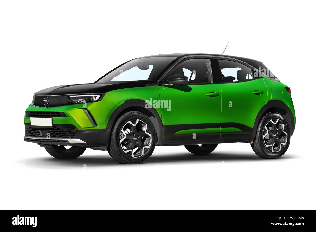 Izmir, Turkey - December 23, 2023: Studio shot of a green 2022 Opel Mokka showing its left side with a partial front view against a white background, Stock Photo