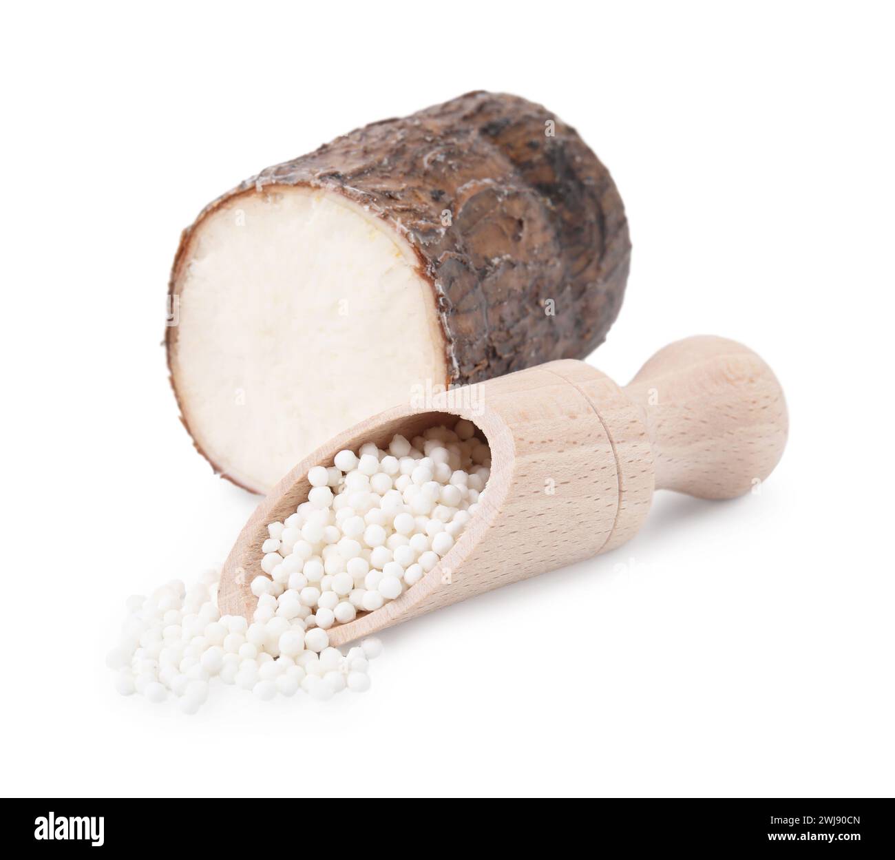 Scoop with tapioca pearls and cassava root isolated on white Stock Photo
