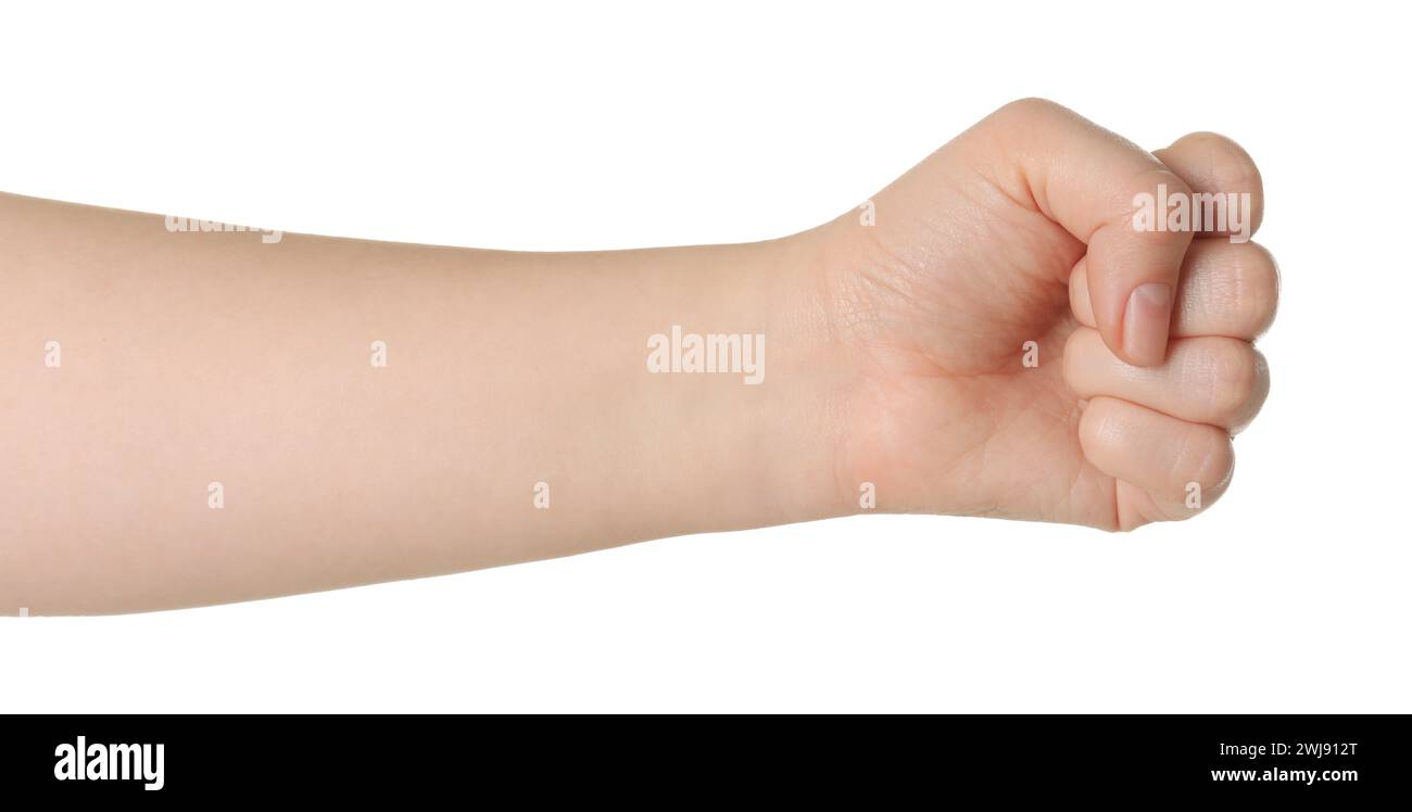 Playing rock, paper and scissors. Woman showing fist on white background, closeup Stock Photo