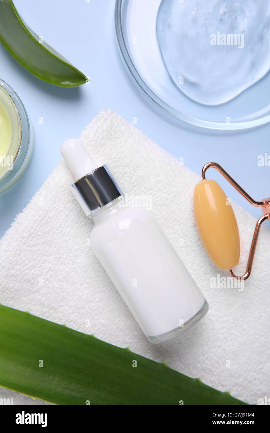 Flat lay composition with cosmetic products and cut aloe leaves on ...